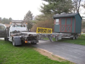 Shed Relocation with Truck and Trailer of small storage shed or utility shed