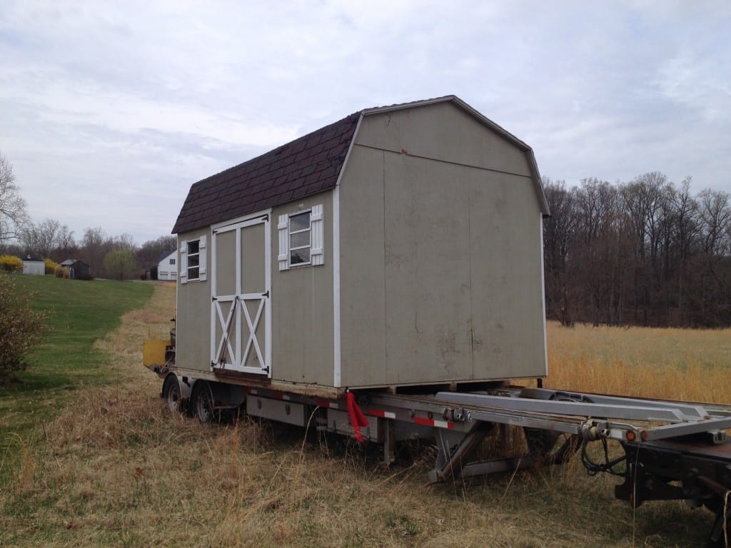 Old worn out storage shed was removed from home in Germantown md and replaced by new storage barn builder 4-outdoor. old storage barn in shown on trailer that 4-outdoor reviews every morning to ensure proper function